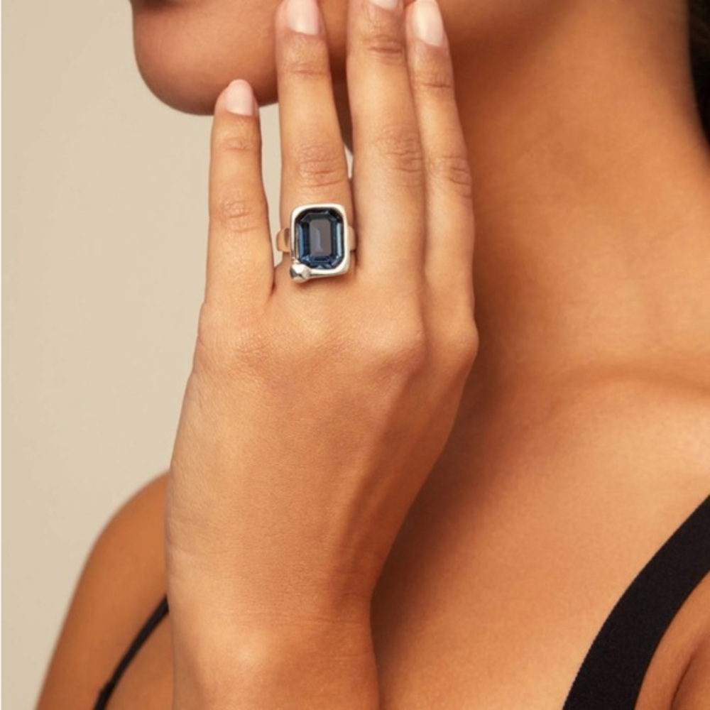 Silver plated ring with rectangular shape and blue crystal in the middle